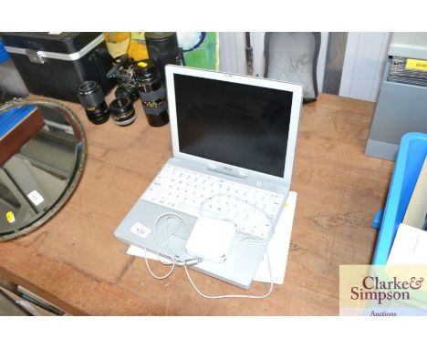 An Apple iBook charger and instruction manual (sold as seen)