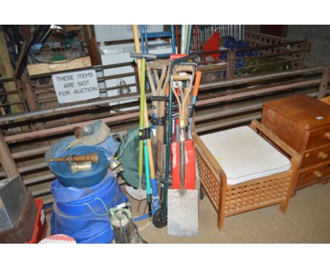A large quantity of long handled gardening tools