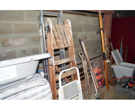 A wooden step ladder, an aluminium step ladder and a set of steps
