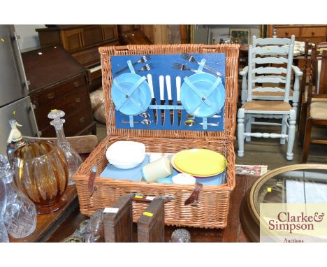 A wicker picnic hamper and contents 