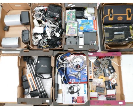 A large collection of vintage electrical gadgets to include head phones, video converters, vintage computer console, walkmans