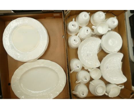 A collection of Wedgwood Strawberry and Vine undecorated tea ware to include - cups, saucers, sugar bowl together with dinner