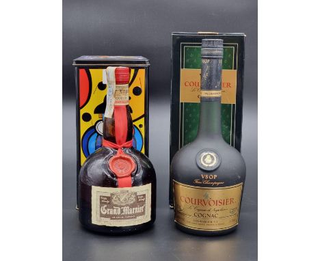 A 70cl bottle of Courvoisier VSOP Cognac, card box; together with a 70cl bottle of Grand Marnier, in metal tin. (2)