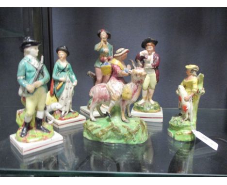A ceramic mother and her children on a goat, a 'shepardiss', a huntsman and his dog and three others  