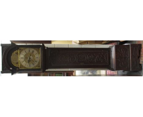A 19th century heavily carved oak longcase clock, the brass dial with pierced brass spandrels and twin train movement, by Jos
