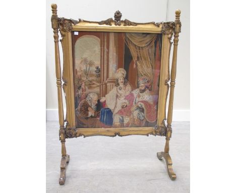 An early Victorian gilt gesso framed fire screen, inset with petit point panel, 110 (h) x 80 (w) cm  