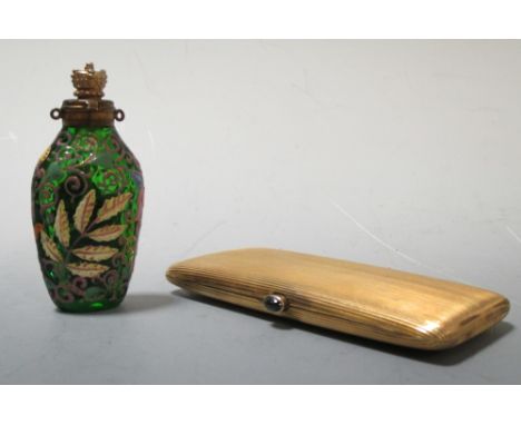 A gilt cigarette case and Moser scent bottle  