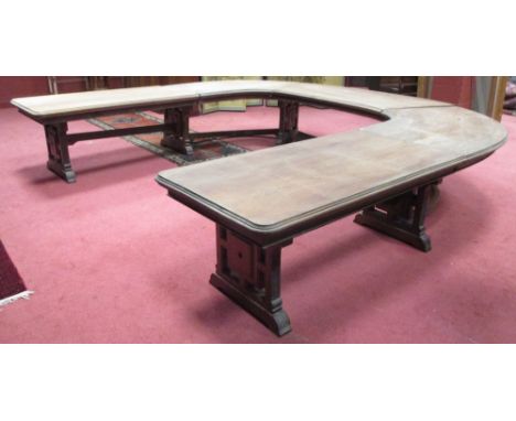 A late Victorian walnut dining table, of horseshoe design, scale carved standard end supports, circa 1890  