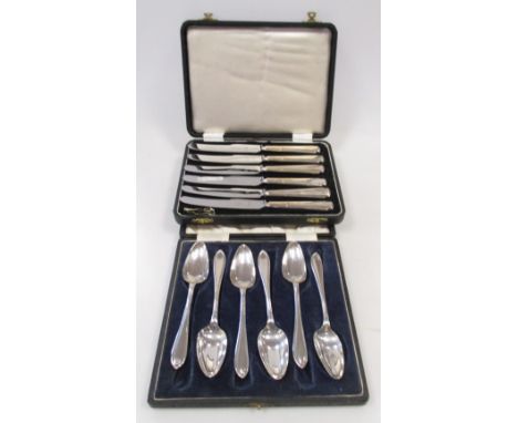 A set of six silver grapefruit spoons by Viners, 1935 and a cased set of six silver handled tea knives, 1952  