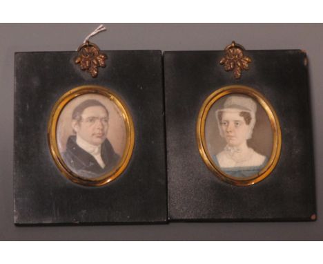 Two 19th century portrait miniatures on ivory, the gentleman with brown hair, a white stock and black coat the lady with brow