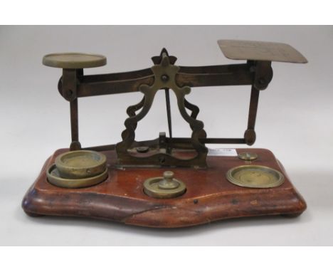 A set of brass letter scales and weights  
