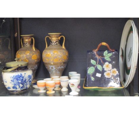 A mixed collection of china, glass and ornaments, including a pair of Noritake vases and a majolica cheese dish, (4 shelves) 
