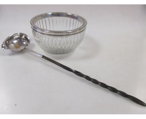 A George III glass bowl with silver rim, no maker's mark, London 1802, together with a silver punch ladle with twisted whaleb