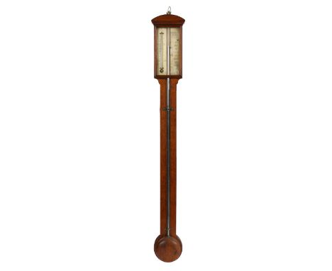 a glazed door enclosing an engraved silver plate with barometer and thermometer scales, in an edge moulded mahogany case, the
