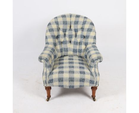 Having button back upholstery, scroll armrests and raised on turned front legs and brass castors, stamped to one back leg, 80