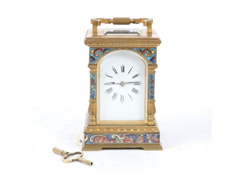 With a cloisonné enamel arched top and columns and a plinth base, a white enamel dial and Roman hours, the movement stamped F