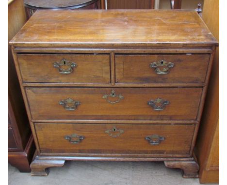 A 19th century walnut chest, the rectangular top above two short and two long drawers on bracket feet