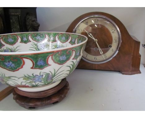 A walnut mantle clock together with an oriental bowl on a stand