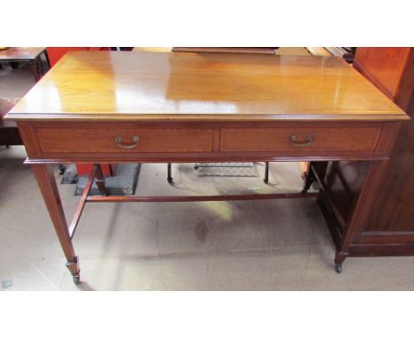 A 19th century mahogany side table, the rectangular top above two drawers on square tapering legs and spade feet