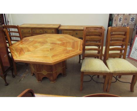 A modern dining room suite comprising an octagonal topped table, eight chairs, a sideboard, side table and coffee table