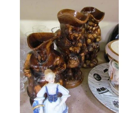 Treacle glazed Toby jugs together with a Homemaker plate, Nao seated figure, Goebel seated cat, jaguar figure, drinking glass