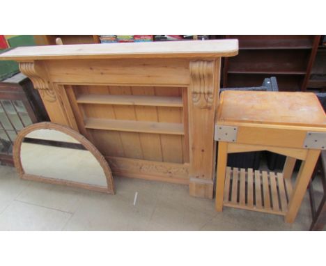A Pine butchers block together with a pine fire surround, pine wall mounted plate racks and an overmantle mirror 