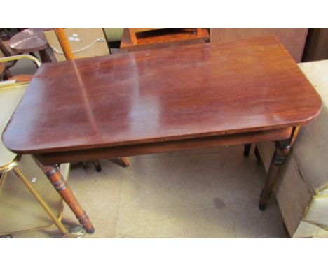 A 19th century mahogany side table, the rectangular top with rounded corners on ring turned tapering legs