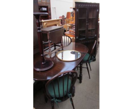 A 20th century oak gateleg dining table together with a set of four stick back chairs, a standing corner cupboard, drop leaf 