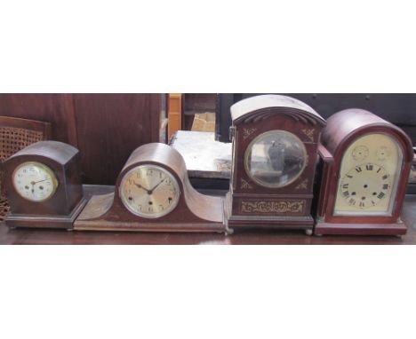 A 19th century mahogany clock case with brass inlay and ball feet together with an oak mantle clock and two other mantle cloc