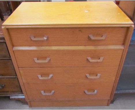 A G-Plan light oak chest, the rectangular top above four long graduated legs