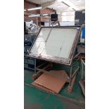 Adjustable tilting light table