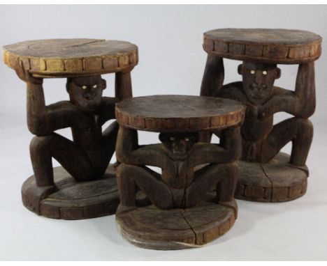 Papua New Guinea Sepik River, three similar low hardwood tables, each carved from a single section of tree trunk, with circul