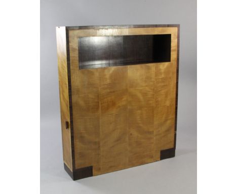 An Art Deco satinwood and Madagascar ebony side cabinet, with rectangular open space mounted with electric light fitting, wit