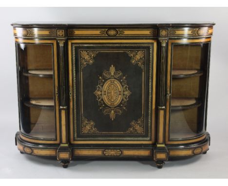 A Victorian ebonised and satinwood banded credenza, with paterae and anthemion inlays, with central cupboard door between bow