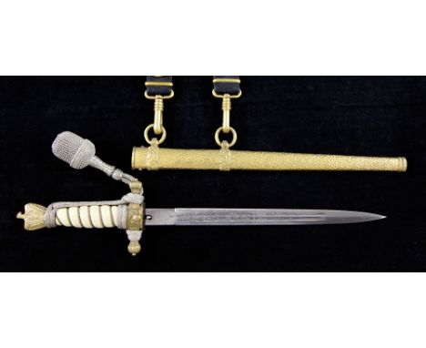 A Third Reich naval dagger by Carl Eickhorn, Solingen, with etched blade, gilt scabbard and wirebound celluloid grip, silver 