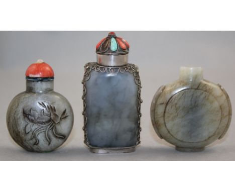 Three Chinese pale grey jade snuff bottles, 1850-1940, the first of watch form with an oval foot, 5.6cm the second of flatten