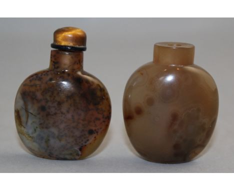 Two Chinese chalcedony snuff bottles, 1750-1900, both of flask form, the first with black speckled inclusions, 4.5cm, the oth