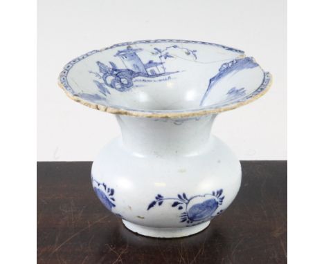 A mid 18th century English? blue and white delftware spittoon, the flared trumpet rim decorated with rural scenes and edged i