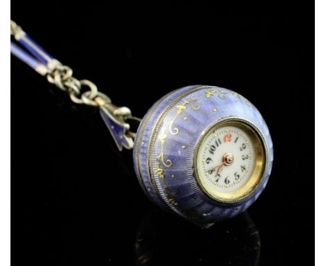 An early 20th century continental silver and blue guilloche enamel globe fob watch, with Arabic dial and gilt scroll decorati