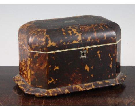 A Victorian tortoiseshell two division tea caddy, with canted corners and squat bun feet, 9in.