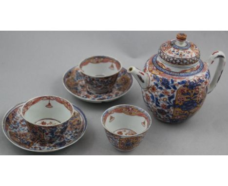 A Chinese export Dutch decorated teapot, three teabowls and two saucers, 18th century, each painted in underglaze blue in jin