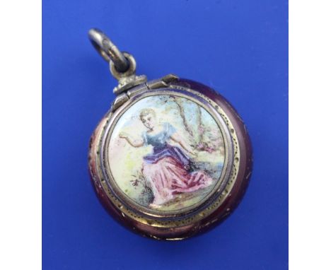 A 19th century continental silver gilt and enamel vinaigrette, of circular form, with gilt and red enamel body (a.f.), the li