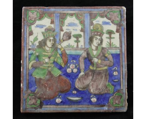 A Persian Qajar dynasty moulded polychrome pottery tile, decorated under the glaze with an interior garden room scene of two 