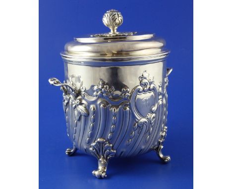 A late Victorian silver two handled biscuit box and cover by Charles Stuart Harris, with demi spiral fluted and foliate decor