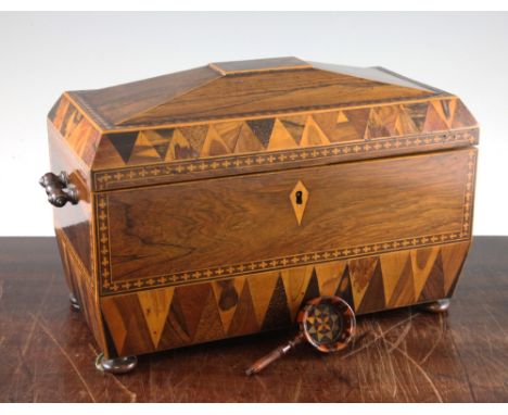 An early 19th century Tunbridgeware rosewood sarcophagus shape tea caddy, with Van Dyke parquetry borders and turned side han