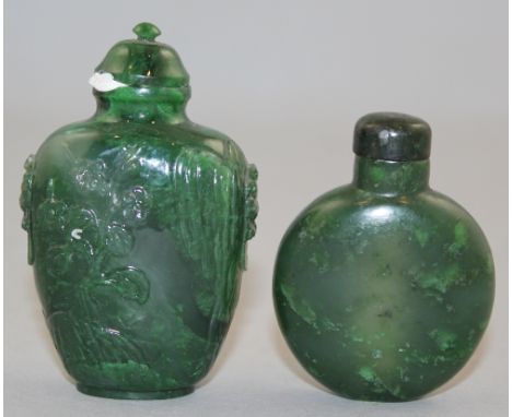 Two Chinese spinach green jade snuff bottles, 1800-1940, the first of moonflask shape with a slightly concave elliptical foot