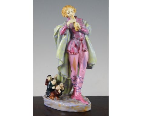 A Royal Doulton group 'The Modern Piper', c.1932, modelled as a golden haired young piper with five children poised like rats