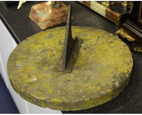 A 19th century circular sandstone sundial, with black painted gnomon, W.16in.