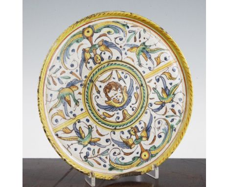 A Deruta maiolica tazza, Italy, first half 17th century, painted in polychrome colours to the centre with a winged putto's he