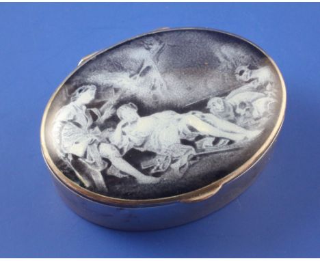 An early 20th century continental 935 standard silver and enamel oval pill box, the hinged lid decorated with lovers beside a